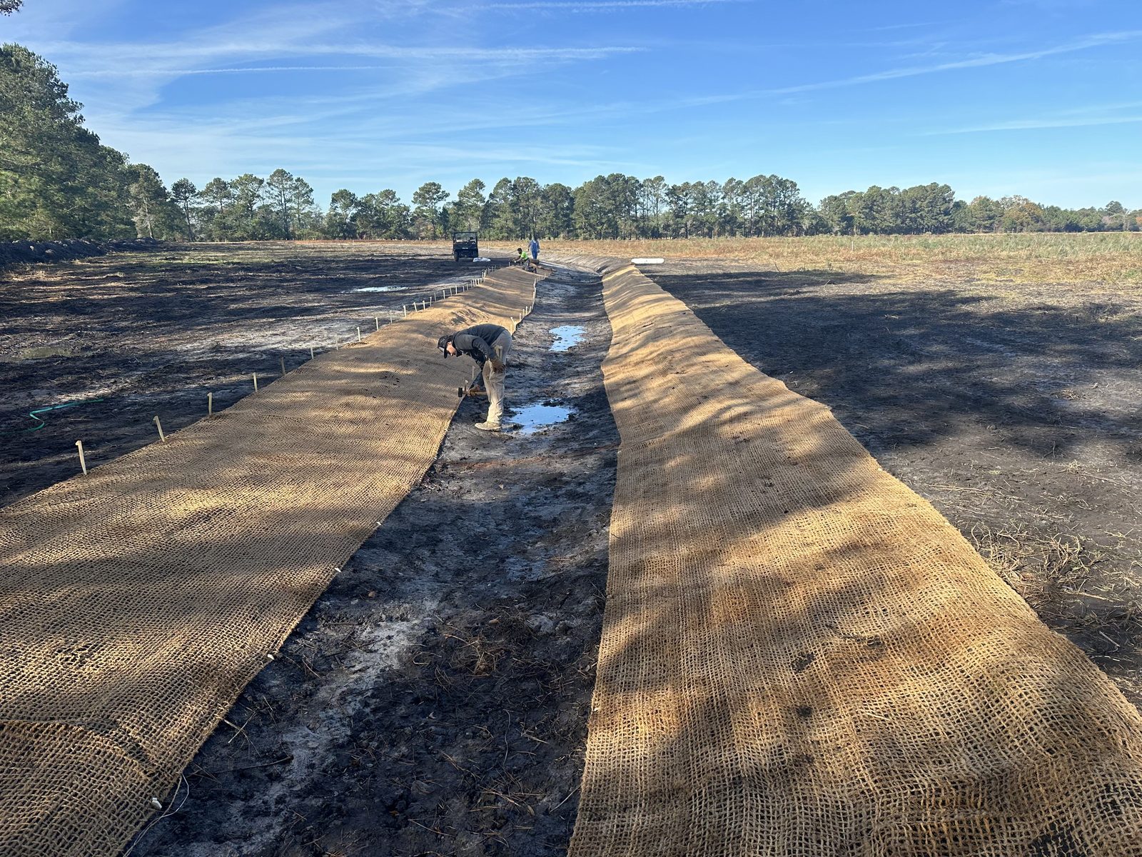 Erosion-control matting installed on stream banks